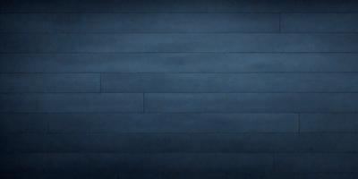 The primary subject of the image is a blue wall with a wooden texture. The setting is a dark room, and the visual style appears to be a photo. The dominant colors are blue and brown, creating a calm and serene atmosphere.