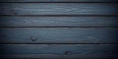 The primary subject of the image is a wooden surface, possibly a wall or a table, with a blue color. The setting is indoors, and the visual style appears to be a photo. The colors and mood of the image are predominantly blue, creating a calm and serene atmosphere.