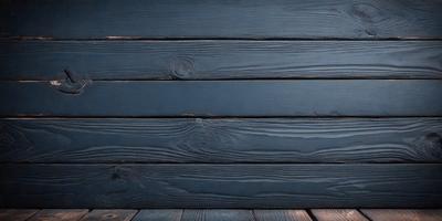 The primary subject of the image is a wooden wall with a blue color. The setting is a wooden surface, possibly a table or a wall. The visual style is a photo, capturing the wooden wall and its blue color. The colors and mood of the image are predominantly blue, creating a calm and serene atmosphere.