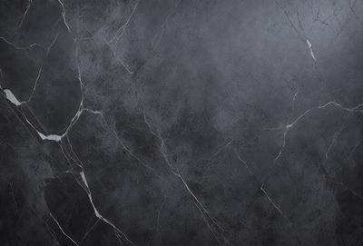 The primary subject of the image is a gray marble wall with a rough texture. The setting is a room with a gray background, which adds to the overall atmosphere. The visual style is a close-up of the marble wall, showcasing its unique texture and appearance. The colors and mood of the image are predominantly gray, giving it a calm and sophisticated feel.