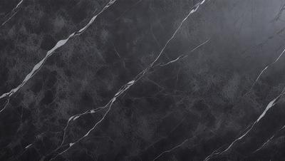 The primary subject of the image is a black marble countertop. The setting is a kitchen, with the countertop being the main focus of the scene. The visual style is a close-up of the marble countertop, showcasing its texture and pattern. The colors and mood of the image are predominantly dark, with the black marble countertop being the main source of contrast.
