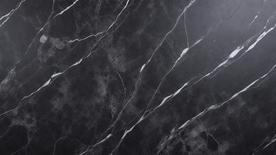 The primary subject of the image is a black and white marble tile wall. The setting is a room with a black background, which emphasizes the marble tile pattern. The visual style is a close-up of the marble tile, showcasing its intricate design. The colors and mood of the image are predominantly black and white, giving it a classic and elegant appearance.