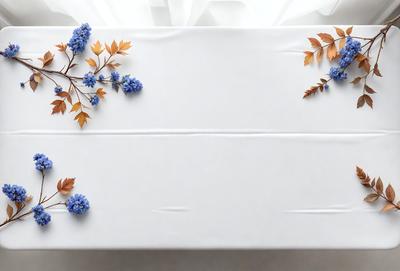 The primary subject of the image is a white table with a blue flower arrangement on it. The table is set against a white background, giving the scene a clean and minimalist appearance. The visual style of the image is a combination of photo and digital art, as it features a realistic representation of the table and flower arrangement, but also has a touch of digital artistry in the way the flowers are arranged and the overall composition. The colors and mood of the image are predominantly white and blue, creating a calm and serene atmosphere