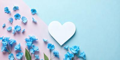 The primary subject of the image is a white heart-shaped paper, which is placed on a pink and blue background. The setting is a wall, and the visual style appears to be a combination of a photo and digital art. The colors and mood of the image are predominantly blue and pink, creating a warm and inviting atmosphere.