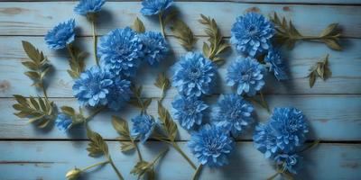 The primary subject of the image is a blue flower, which is the main object, scene, or focus of the image. The setting is a wooden table, and the visual style is a photo. The dominant colors in the image are blue and white, creating a calm and serene atmosphere.
