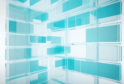 The primary subject of the image is a large, blue glass wall. The setting is a white room, and the visual style is a modern, minimalist design. The dominant colors are blue and white, creating a clean and calming atmosphere.