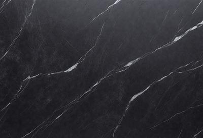 The primary subject of the image is a black marble countertop. The setting is a kitchen, with the countertop being the main focus of the scene. The visual style is a close-up of the marble countertop, showcasing its texture and pattern. The colors and mood of the image are predominantly dark, with the black marble countertop being the main source of contrast.
