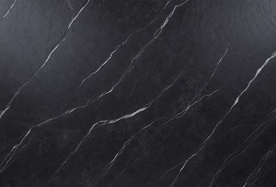 The primary subject of the image is a black marble countertop. The setting is a kitchen, with the countertop being the main focus of the scene. The visual style is a close-up of the marble countertop, showcasing its texture and pattern. The colors and mood of the image are predominantly dark, with the black marble countertop being the main source of contrast.