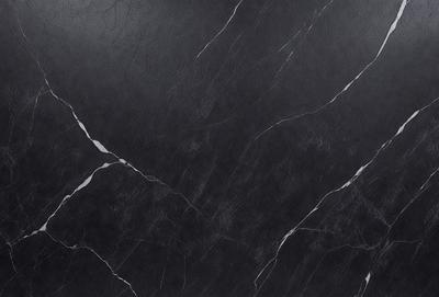 The primary subject of the image is a close-up of a marble countertop. The setting is a kitchen, with the countertop being the main focus of the scene. The visual style is a photo, capturing the intricate details of the marble surface. The colors and mood of the image are predominantly black and white, giving it a classic and elegant appearance.