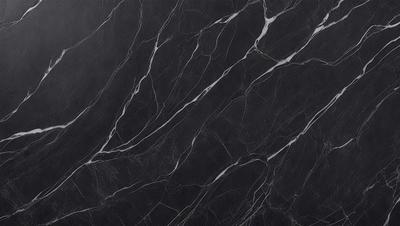The primary subject of the image is a black marble countertop. The setting is a kitchen, with the countertop being the main focus of the scene. The visual style is a close-up of the marble countertop, showcasing its texture and pattern. The colors and mood of the image are predominantly dark, with the black marble countertop being the main source of contrast.