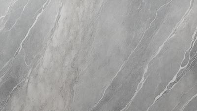 The primary subject of the image is a marble wall with a patterned texture. The setting is a room with a grey marble wall as the main focus. The visual style is a close-up of the marble wall, showcasing its intricate pattern. The colors and mood of the image are predominantly grey, giving it a sophisticated and elegant appearance.