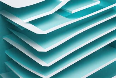 The primary subject of the image is a stack of blue and white paper. The setting is a white background, and the visual style appears to be a photo. The colors and mood of the image are predominantly blue and white, creating a clean and organized appearance.