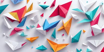 The primary subject of the image is a collection of colorful paper kites. These kites are displayed in various shapes and sizes, creating a visually appealing and vibrant scene. The setting is a white wall, which serves as a clean and uncluttered backdrop for the kites. The visual style of the image is a combination of photo and digital art, as the kites are presented in a realistic manner while also showcasing the artist's creativity. The colors and mood of the image are