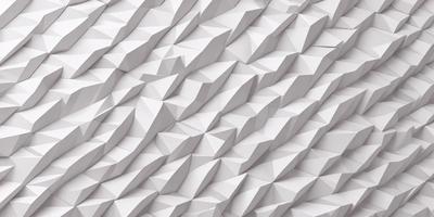 The primary subject of the image is a white wall with a pattern of white triangles. The setting is a room with a white background, and the visual style is a close-up of the wall. The dominant colors are white, and the overall atmosphere is clean and minimalistic.