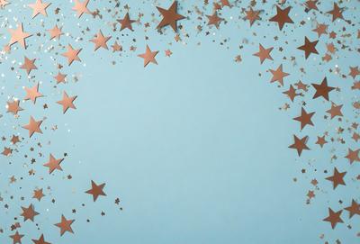 The primary subject of the image is a blue background with a pattern of stars. The setting is a blue wall, and the visual style is a digital art or illustration. The dominant colors are blue and gold, creating a calm and serene atmosphere.