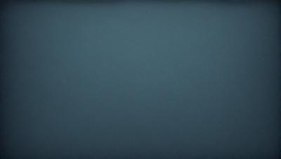 The primary subject of the image is a blue background. The setting is a dark, empty space with no visible objects or people. The visual style is a simple, monochromatic design. The colors and mood are predominantly dark and moody, with the blue background creating a sense of calmness and tranquility.
