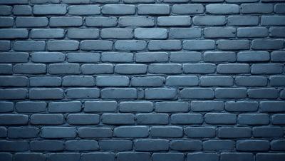 The primary subject of the image is a blue brick wall. The setting is a brick wall, and the visual style is a photo. The dominant colors are blue and gray, creating a calm and serene atmosphere.