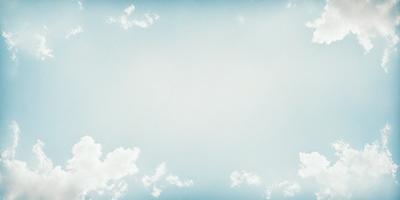 The primary subject of the image is a clear blue sky with a few clouds scattered throughout. The setting is a vast, open space with no visible landmarks or objects. The visual style is a natural, outdoor scene with a focus on the sky and clouds. The colors and mood are predominantly blue and serene, creating a peaceful and tranquil atmosphere.