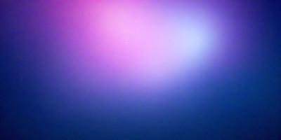 The primary subject of the image is a pink and purple sky. The setting is a cloudy sky, with the clouds being pink and purple. The visual style is a photo, capturing the vibrant colors of the sky. The colors and mood of the image are lively and energetic, with the pink and purple hues creating a sense of warmth and liveliness.