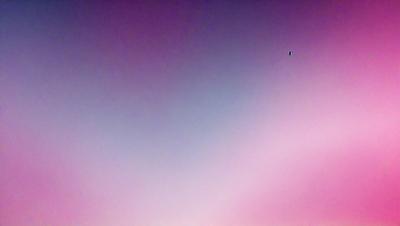 The primary subject of the image is a large, open sky with a pink hue. The sky appears to be cloudy, and there is a single bird flying in the distance. The setting is a vast, open space with no visible landmarks or objects. The visual style of the image is a combination of a photo and a digital artwork, creating a unique and artistic representation of the sky. The colors and mood of the image are predominantly pink, giving it a serene and calming atmosphere.