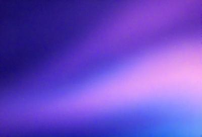 The primary subject of the image is a purple and pink light, which appears to be a light source or a reflection of light. The setting is a dark background, which contrasts with the light source. The visual style of the image is a combination of digital art and illustration, creating a unique and artistic representation of the light. The colors and mood of the image are predominantly purple and pink, giving it a warm and inviting atmosphere.