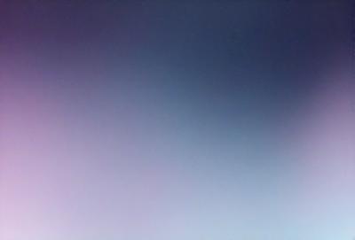 The primary subject of the image is a blue sky with no clouds. The setting is a vast, open space with no visible landmarks or objects. The visual style is a natural, outdoor scene. The colors and mood are serene and peaceful, as the sky is clear and void of any distractions.