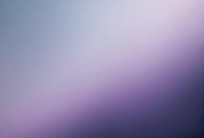 The primary subject of the image is a purple background. The setting is a cloudy sky, and the visual style is a photo. The colors and mood of the image are predominantly purple, creating a calm and serene atmosphere.