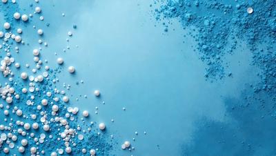 The primary subject of the image is a blue background with white specks or bubbles scattered across it. The setting appears to be a blue wall or a blue surface, which creates a visually appealing contrast with the white specks. The visual style of the image is a combination of a photo and digital art, as it captures the unique texture and pattern of the blue and white specks. The colors and mood of the image are predominantly blue and white, giving it a calm and serene atmosphere.