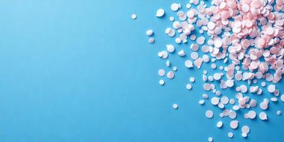 The primary subject of the image is a close-up of a blue wall with a pattern of white dots. The setting is a room with a blue background, and the visual style appears to be a photo. The dominant colors are blue and white, creating a calm and soothing atmosphere.