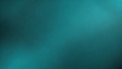 The primary subject of the image is a blue background, which appears to be a piece of art or a painting. The setting or background is a dark blue surface, and the visual style is a close-up of the artwork. The colors and mood of the image are predominantly dark and moody, with the blue background creating a sense of depth and mystery.