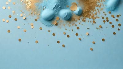 The primary subject of the image is a blue background with gold glitter sprinkled on it. The setting appears to be a creative and artistic environment, possibly a studio or a workspace. The visual style of the image is a combination of digital art and illustration, with the gold glitter creating a unique and eye-catching effect. The dominant colors in the image are blue and gold, giving it a calm and soothing atmosphere.