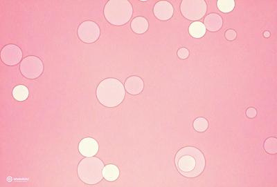 The primary subject of the image is a pink background with a pattern of white circles. The setting appears to be a pink surface, possibly a wall or a piece of artwork. The visual style of the image is a combination of a photo and a pattern, creating a unique and eye-catching design. The dominant colors in the image are pink and white, giving it a warm and inviting atmosphere.