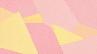 The primary subject of the image is a pink paper with a yellow triangle on it. The setting is a pink background, and the visual style appears to be a combination of a photo and a pattern. The colors and mood of the image are predominantly pink and yellow, creating a warm and inviting atmosphere.