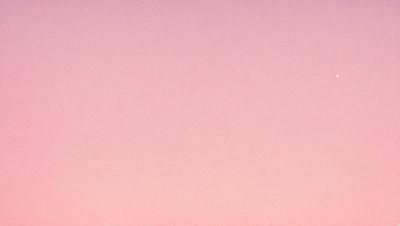 The primary subject of the image is a pink background. The setting is a blank, pink canvas with no visible objects or details. The visual style is a simple, monochromatic design. The colors and mood of the image are predominantly pink, creating a soft and calming atmosphere.