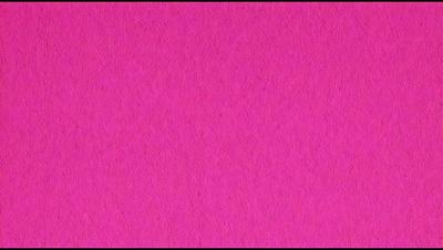 The primary subject of the image is a large, pink surface. The setting is a pink background, which creates a vibrant and bold atmosphere. The visual style is a close-up of the pink surface, emphasizing its color and texture. The colors and mood of the image are predominantly pink, giving it a warm and inviting feel.