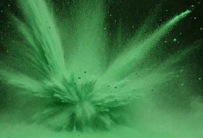 The image features a green, splashing water fountain with a large, green, spraying water effect. The water is shooting up into the air, creating a visually striking scene. The primary subject is the water fountain, which is the main focus of the image. The setting is outdoors, with the water fountain as the main backdrop. The visual style is a combination of photo and digital art, creating a unique and eye-catching effect. The colors and mood are predominantly