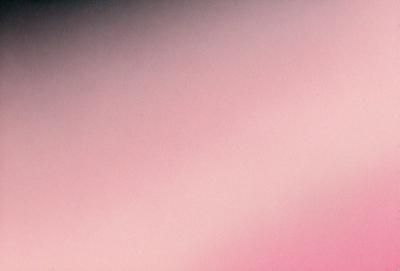 The primary subject of the image is a pink background. The setting is a cloudy sky, and the visual style is a photo. The colors and mood of the image are predominantly pink, creating a warm and inviting atmosphere.