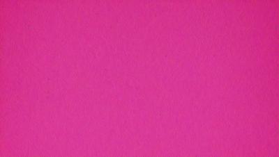 The primary subject of the image is a large, pink surface. The setting is a pink background, and the visual style is a close-up of the pink surface. The colors and mood of the image are predominantly pink, creating a warm and inviting atmosphere.