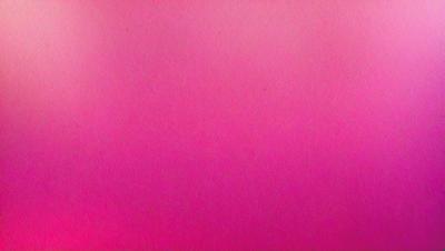 The primary subject of the image is a large, pink wall. The setting is a room with a pink background, and the visual style appears to be a photo. The dominant colors in the image are pink, and the overall atmosphere is bright and vibrant.