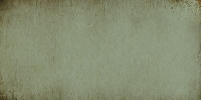 The primary subject of the image is a large, light-colored wall. The setting is a room with a brown surface, possibly a wallpaper or a painted wall. The visual style is a close-up of the wall, showcasing its texture and color. The colors and mood of the image are predominantly brown and neutral, creating a calm and serene atmosphere.