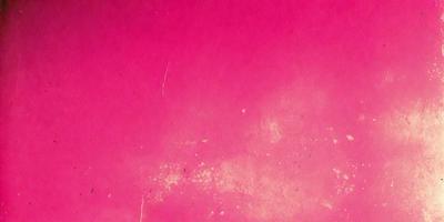 The primary subject of the image is a pink background. The setting is a pink wall, and the visual style is a close-up of the wall. The colors and mood of the image are predominantly pink, creating a warm and inviting atmosphere.