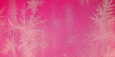 The primary subject of the image is a pink background with white snowflakes scattered across it. The setting appears to be a winter scene, possibly a wallpaper or a pattern. The visual style is a combination of digital art and illustration, creating a unique and eye-catching design. The dominant colors are pink and white, giving the image a warm and cozy atmosphere.
