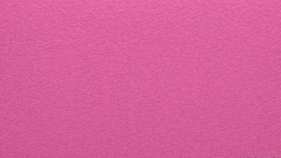 The primary subject of the image is a pink background. The setting is a close-up of the pink background, which appears to be a piece of paper or a wall. The visual style is a close-up of the pink background, which gives a sense of depth and texture to the image. The colors and mood of the image are predominantly pink, creating a warm and inviting atmosphere.