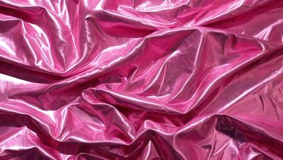 The primary subject of the image is a pink fabric, which is the main object, scene, or focus of the image. The setting or background consists of a pink background, which complements the pink fabric. The visual style of the image is a close-up of the pink fabric, showcasing its texture and details. The colors and mood of the image are predominantly pink, creating a warm and inviting atmosphere.