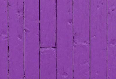 Purple wood paneling on a wall.