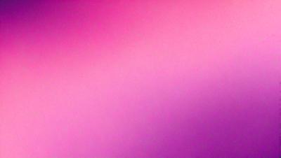 The primary subject of the image is a pink background. The setting is a purple wall, and the visual style appears to be a photo. The dominant colors in the image are pink and purple, creating a warm and inviting atmosphere.