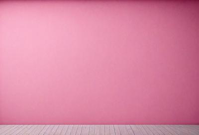 The primary subject of the image is a large pink wall. The setting is a room with a wooden floor. The visual style is a photo, and the dominant colors are pink and white. The overall atmosphere is warm and inviting.
