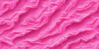 The primary subject of the image is a pink fabric with a pattern of wrinkles and folds. The setting is a pink background, which complements the fabric's color. The visual style is a close-up of the fabric, showcasing its texture and pattern. The colors and mood of the image are predominantly pink, creating a warm and inviting atmosphere.