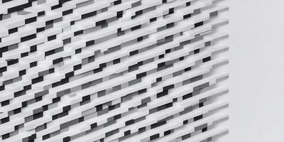 The primary subject of the image is a large white wall with a pattern of black squares. The setting is a white room, and the visual style appears to be a combination of a photo and digital art. The dominant colors are white and black, creating a clean and modern atmosphere.