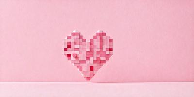 The primary subject of the image is a heart-shaped block made of red and white squares. The heart is placed on a pink surface, which serves as the setting or background. The visual style of the image is a combination of digital art and illustration, as the heart is created using a pattern of squares. The colors and mood of the image are predominantly pink, which gives it a warm and inviting atmosphere.